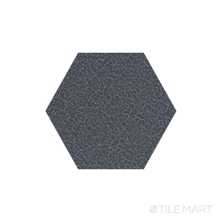 Captured from above, the Inyo Indigo 8" hex satin glazed ceramic tile showcases a deep blue hue with a smooth satin surface, offering a bold and sophisticated touch to modern designs.