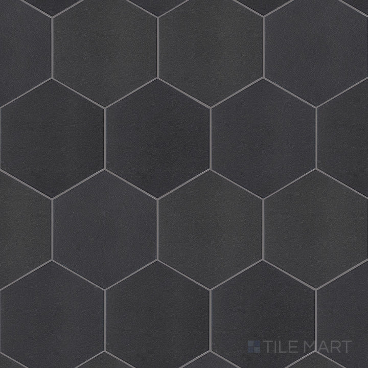 A flat-lay view of Inyo Ink 8" hex satin glazed ceramic tiles, featuring their bold indigo shade and structured hexagonal shape.