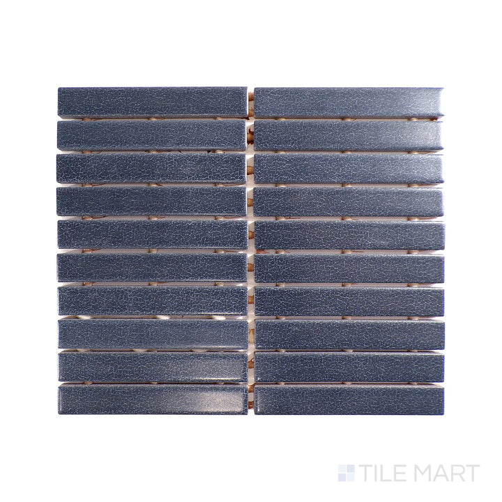 Angled shot of Inyo Indigo rectangle satin glazed ceramic mosaic, featuring a deep blue indigo shade, a smooth satin surface, and a rectangular mosaic format.  