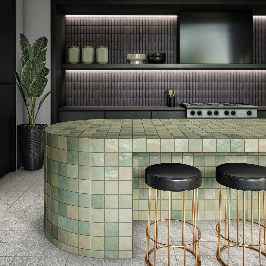 Soft yet striking, the Inyo Ink Rectangle satin glazed ceramic mosaic tile is featured here in a roomscene that emphasizes moody tones and matte-like elegance.