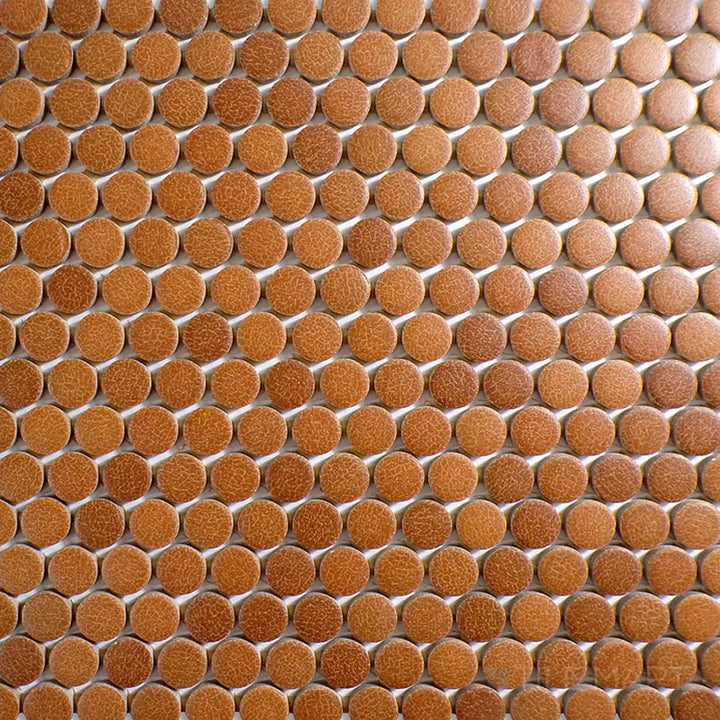 Top-down view of Inyo Ember Penny Round Matte Glazed Ceramic Mosaic, showcasing its warm color in a timeless mosaic design.