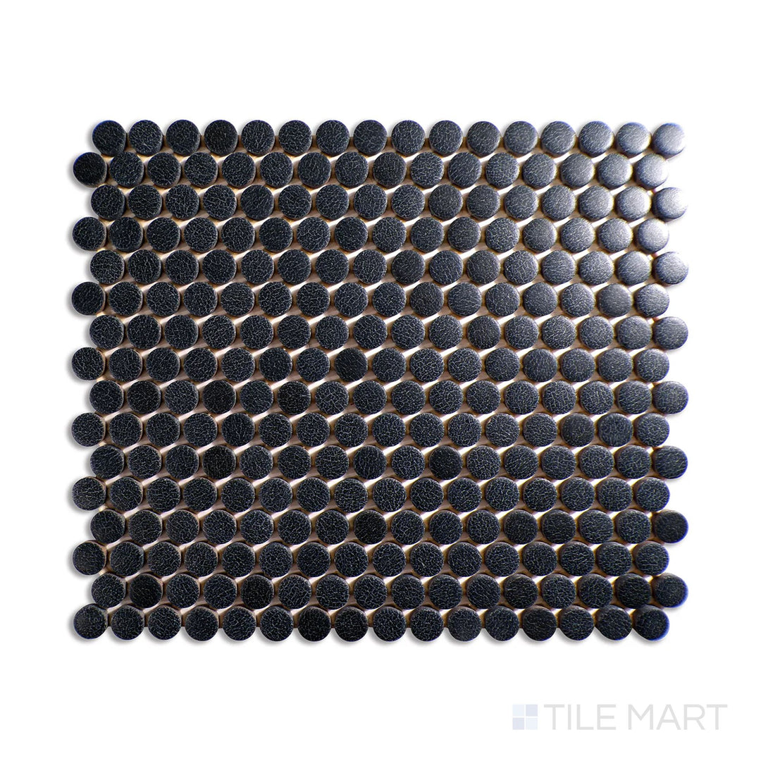 Diagonal view of Inyo Ink penny round matte glazed ceramic mosaic, showcasing a bold black color, matte texture, and classic circular tile layout.  