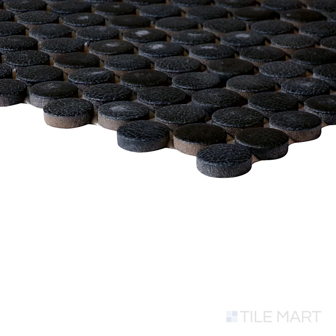 Side perspective of Inyo Ink Penny Round Matte Glazed Ceramic Mosaic, capturing its deep black hues with a modern matte penny-round layout.