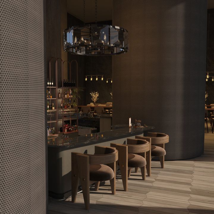 This roomscene captures the charm of Inyo Ink Penny Round matte glazed ceramic mosaic tile, with its rounded form and muted finish creating a textured visual rhythm.