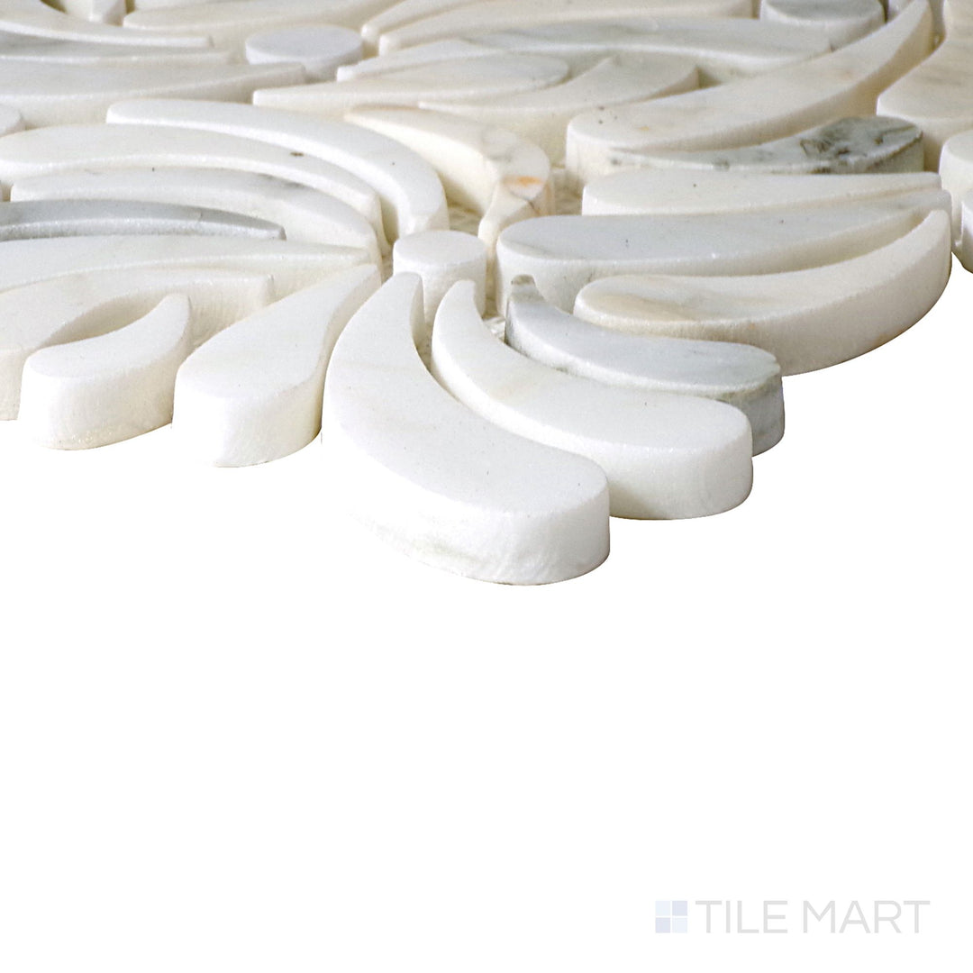 Angled close-up of Lavaliere Calacatta Gold Windblown Honed Mosaic, showcasing its warm Calacatta gold veining with a soft honed finish for an airy, windblown effect.