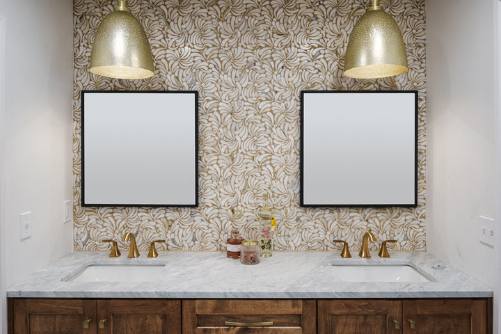 Showcasing natural stone beauty, the Lavaliere Calacatta Gold Windblown honed mosaic tile combines flowing veining with a soft honed texture.