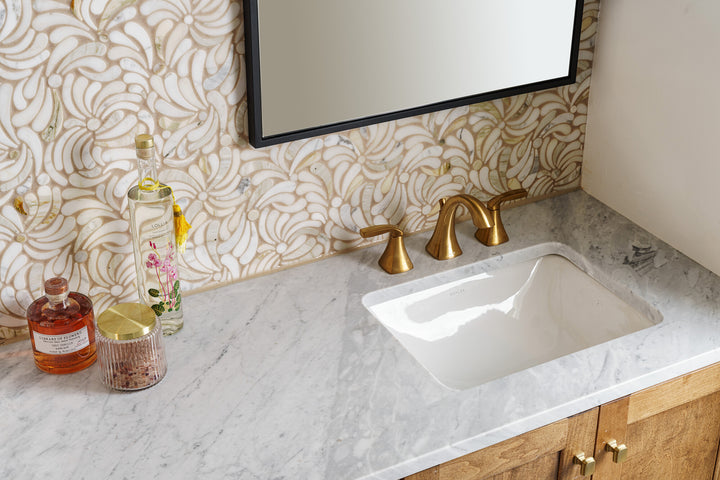 Lavaliere Calacatta Gold Windblown honed mosaic tile features soft golden veining with a flowing, organic arrangement for a serene stone visual.
