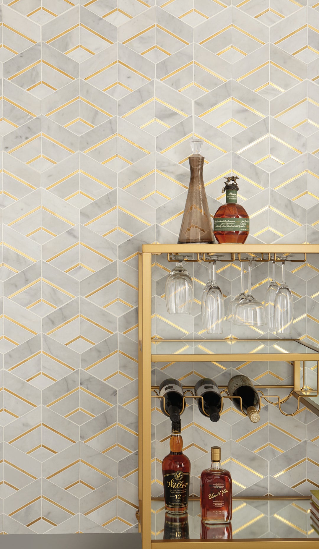 A luminous white marble with interwoven brass accents in a honed finish delivers a modern yet timeless appeal in this Lavaliere Alluring White/Brass Intermix honed marble mosaic.