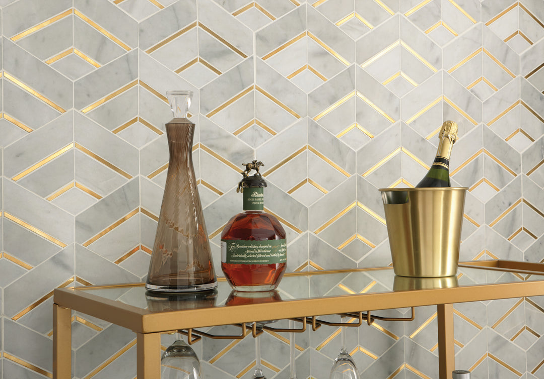 Lavaliere Alluring White/Brass Intermix honed marble mosaic tile featured in a designer space, blending white marble with brass accents for a luxurious contrast.