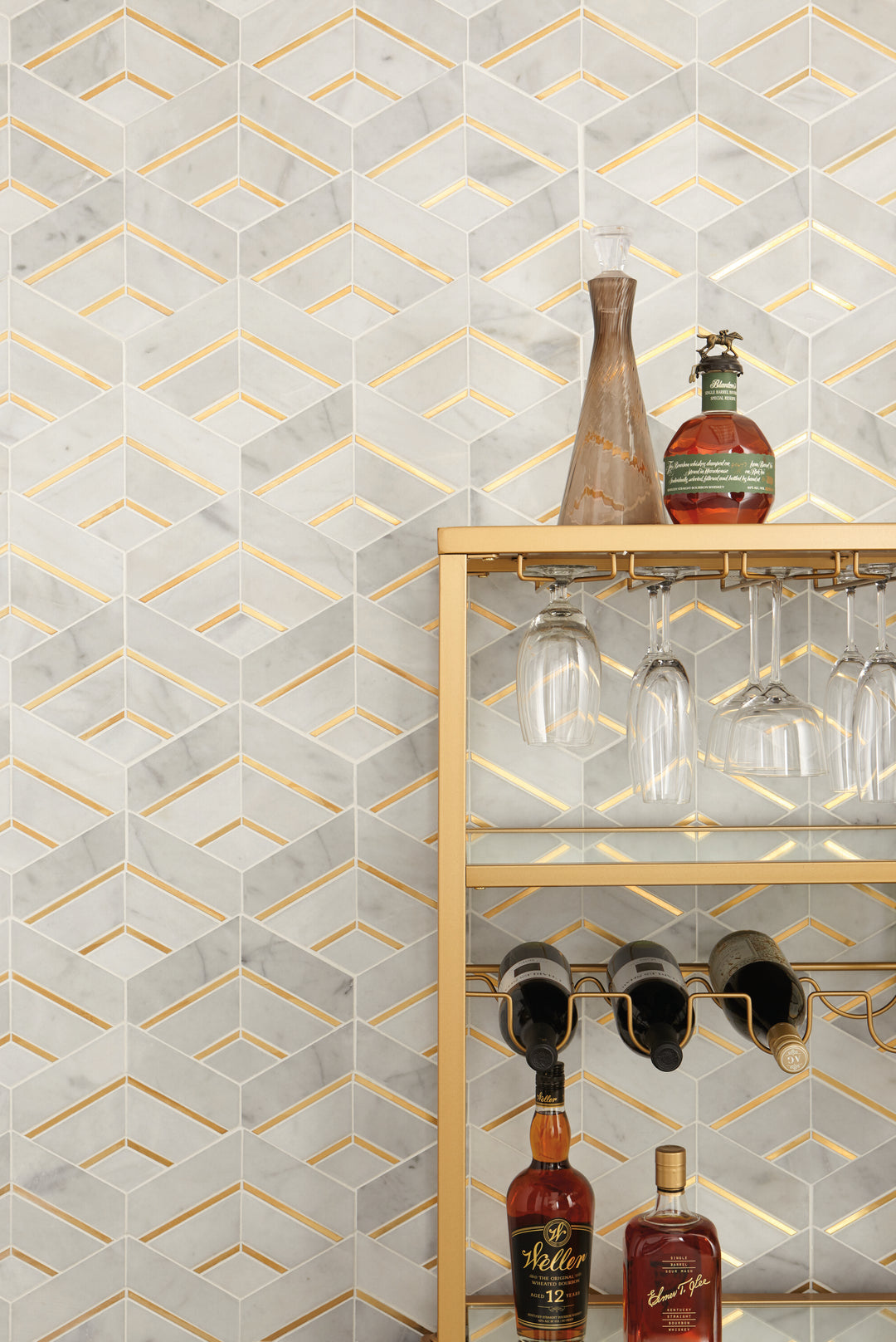 Blending classic and contemporary, the Lavaliere Alluring White/Brass Intermix honed marble mosaic tile integrates warm brass accents with white marble for a luxurious effect.