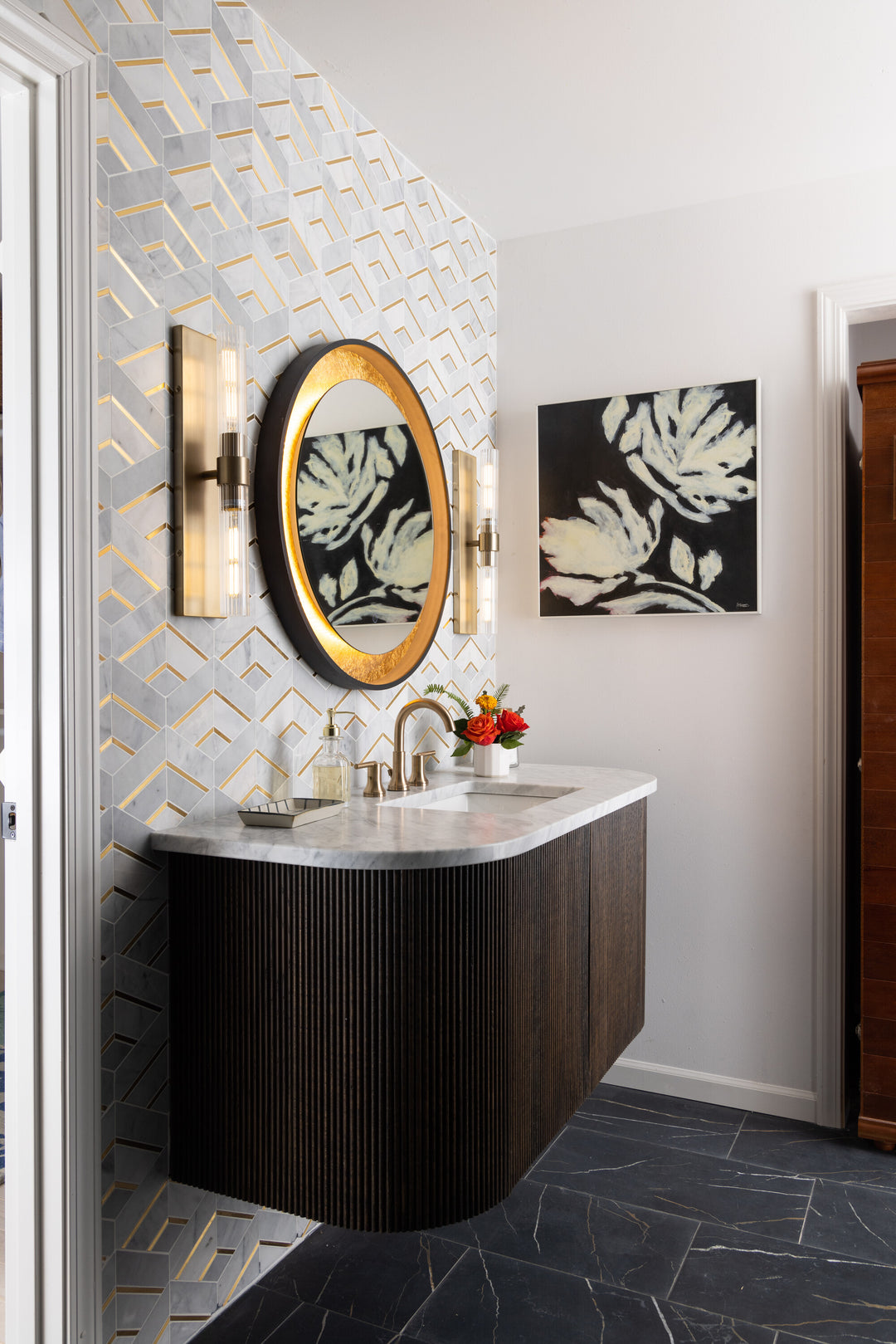 With its luxurious contrast, Lavaliere Alluring White/Brass Intermix honed marble mosaic tile blends warm metallic accents with smooth white marble.