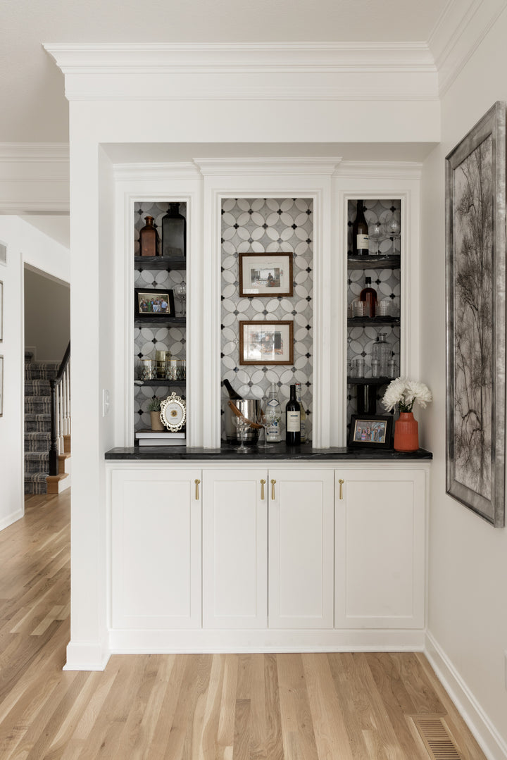 Lavaliere Carrara/Thassos/Black Ant Mirror Petal honed mosaic tile introduces layered textures and tones in an elegant petal layout for a bold, artistic finish.