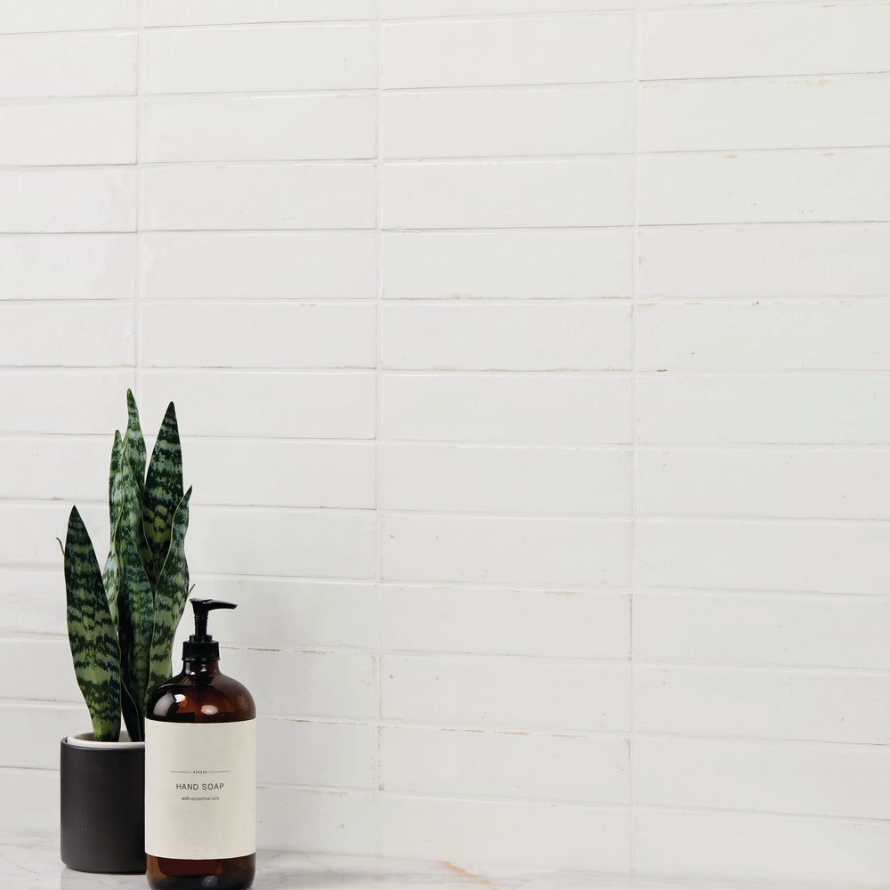 A rich, vibrant hue with a glossy glazed finish creates a sleek and luminous surface in this Remedy Elixir 2x10 glazed porcelain tile.