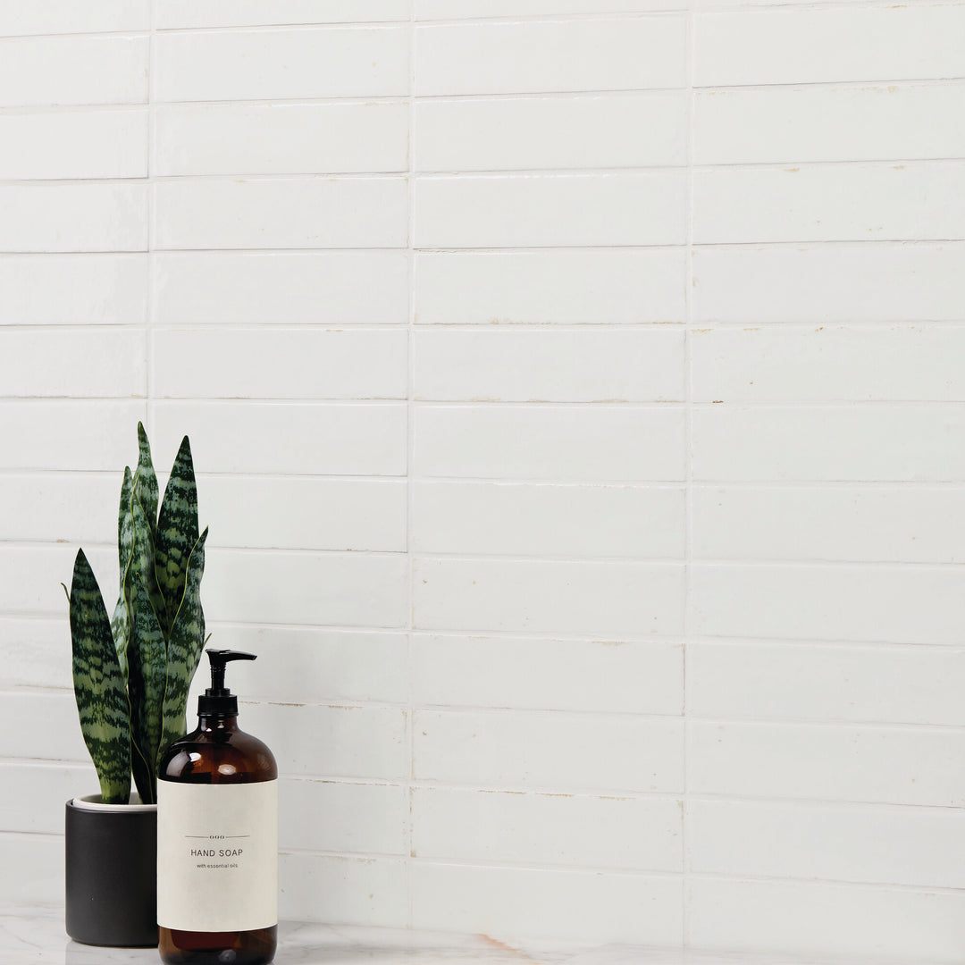 A rich, vibrant hue with a glossy glazed finish creates a sleek and luminous surface in this Remedy Elixir 2x10 glazed porcelain tile.