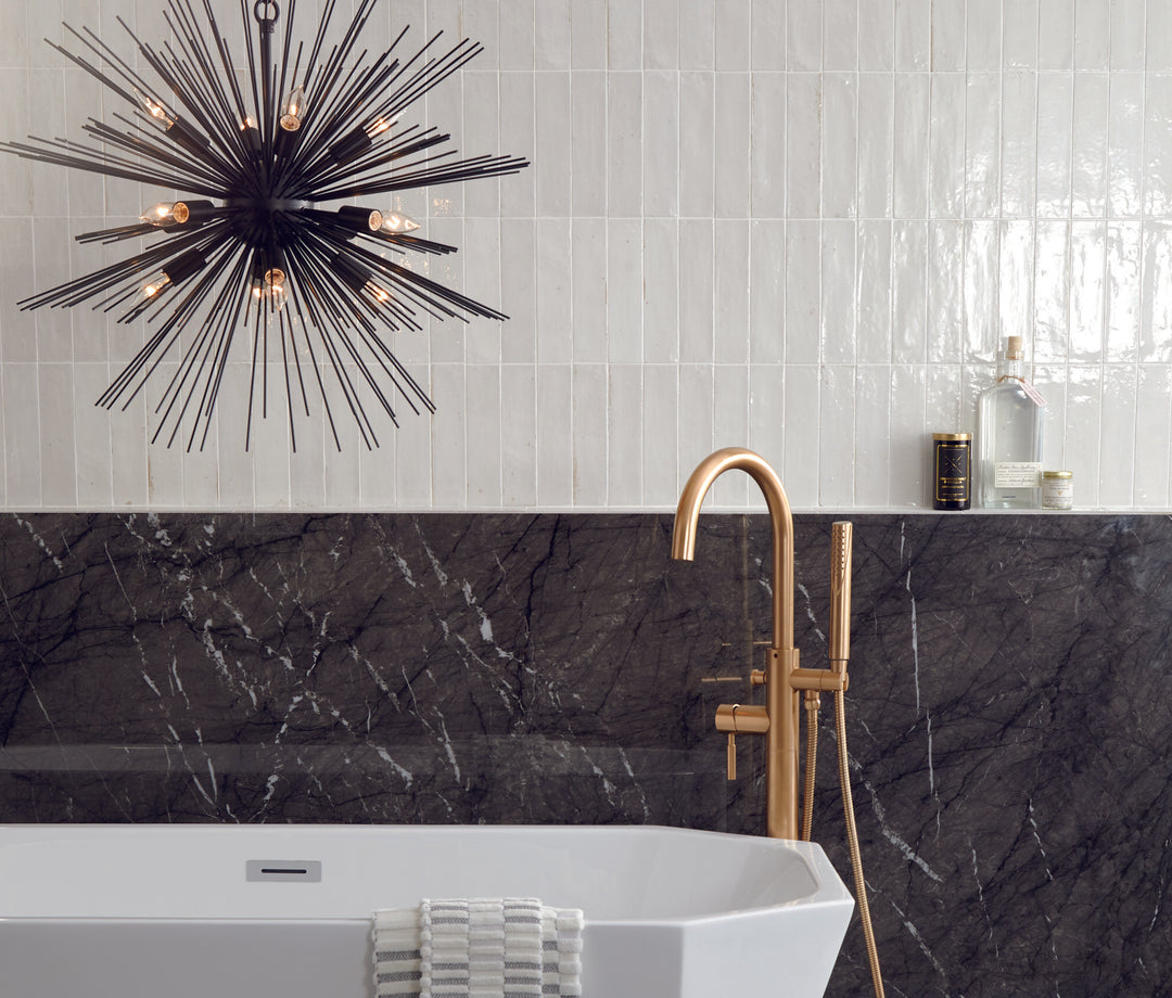 Installed in a real-life space, the Remedy Elixir 2x10 glossy glazed porcelain tile adds a fresh, elongated look with a reflective finish