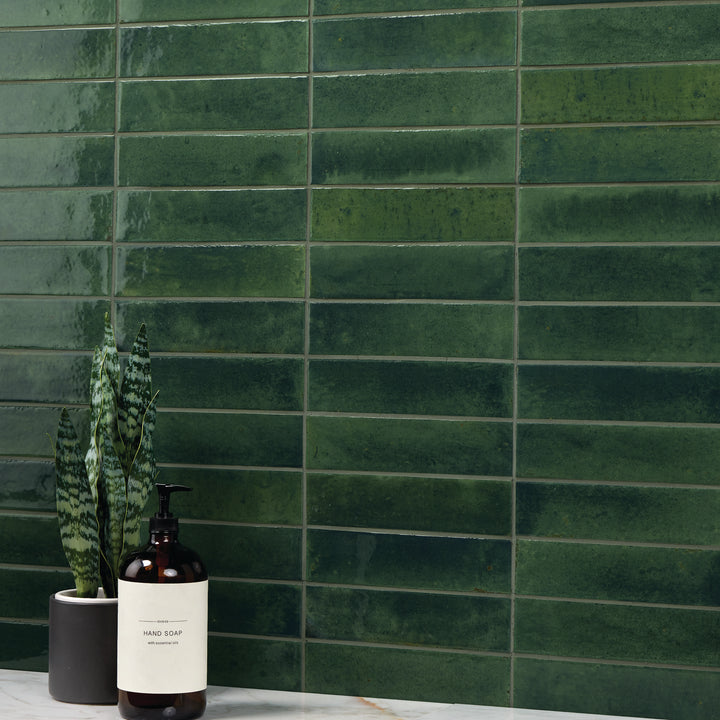A deep, botanical-inspired tone with a high-gloss glaze enhances depth and vibrancy in this Remedy Herbal 2x10 glazed porcelain tile.