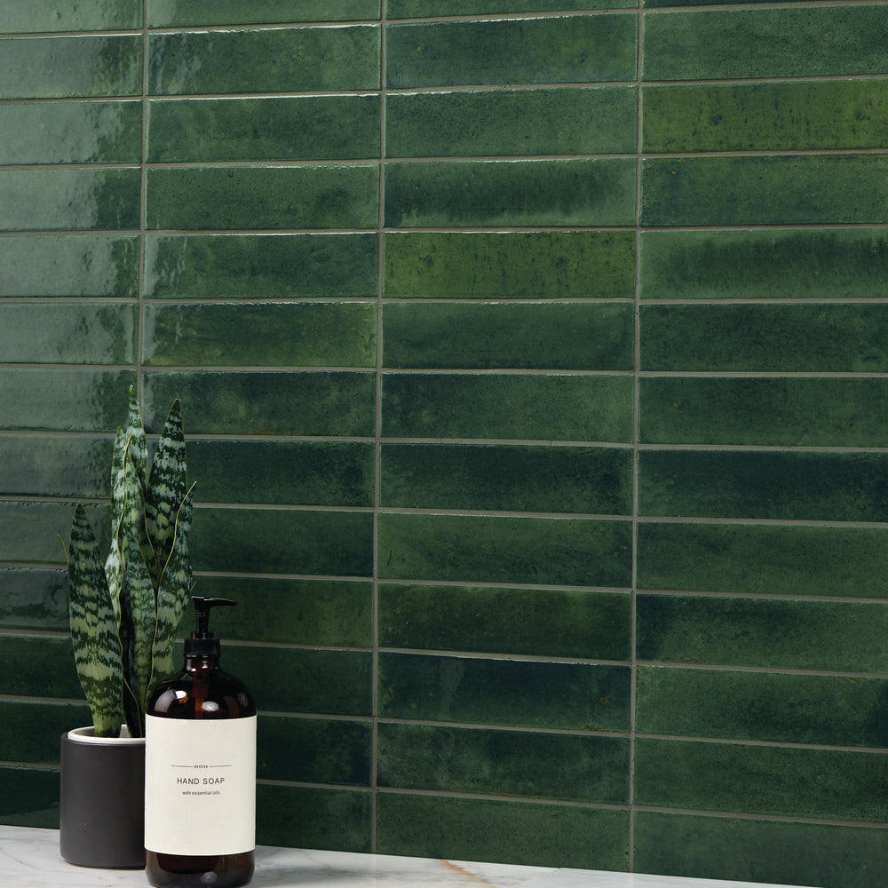 A deep, botanical-inspired tone with a high-gloss glaze enhances depth and vibrancy in this Remedy Herbal 2x10 glazed porcelain tile.