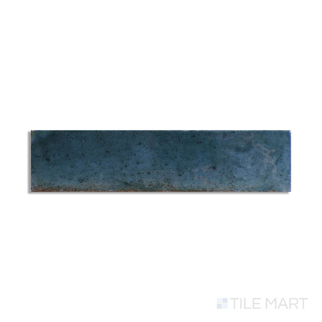 Slanted perspective of Remedy Hydro 2x10 glossy glazed porcelain tile, emphasizing a fresh, aquatic hue, a striking glossy glaze, and a clean linear design.  