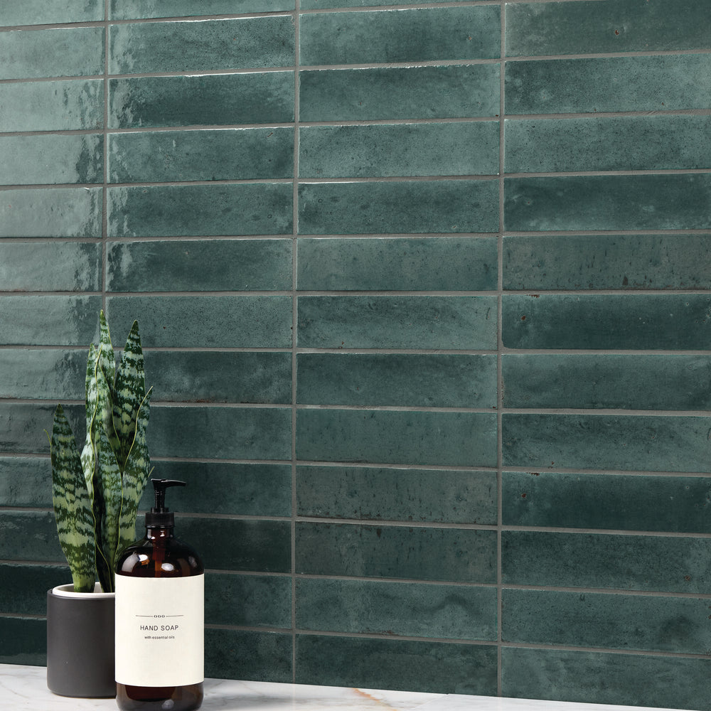 A refreshing, water-inspired shade with a glossy surface adds a smooth and polished look in this Remedy Hydro 2x10 glazed porcelain tile.