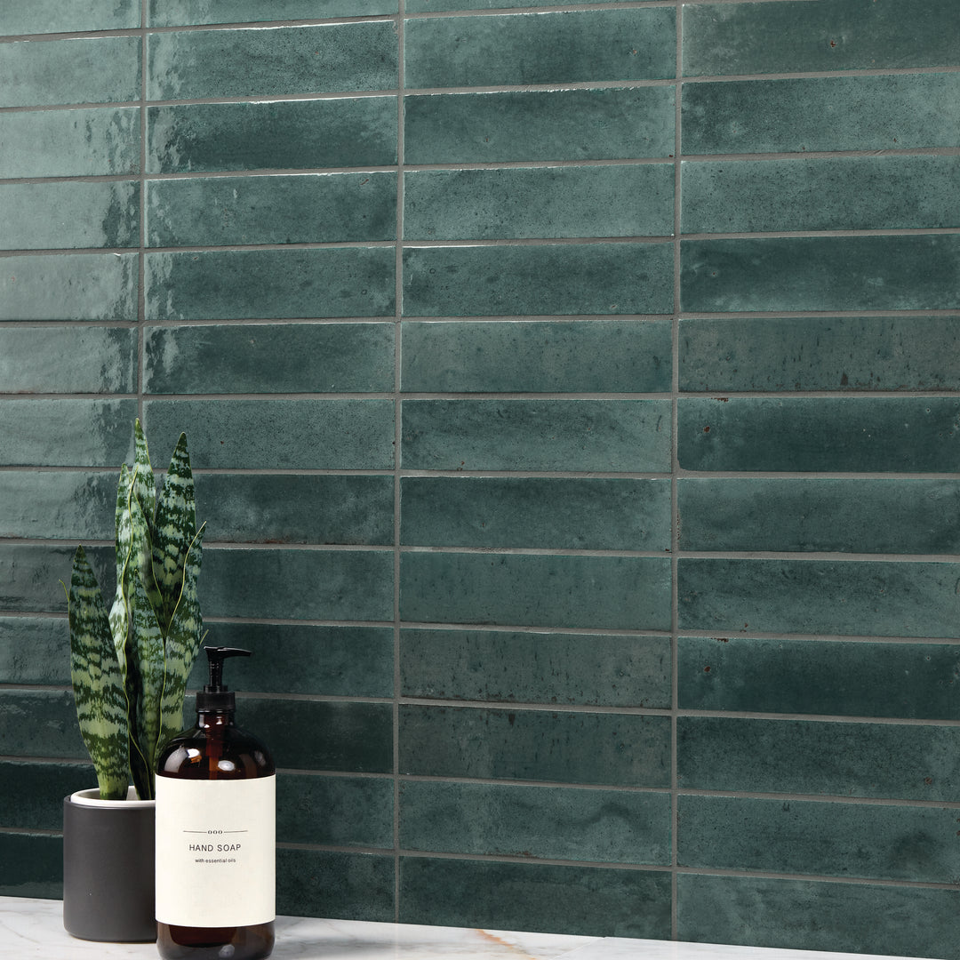 A refreshing, water-inspired shade with a glossy surface adds a smooth and polished look in this Remedy Hydro 2x10 glazed porcelain tile.