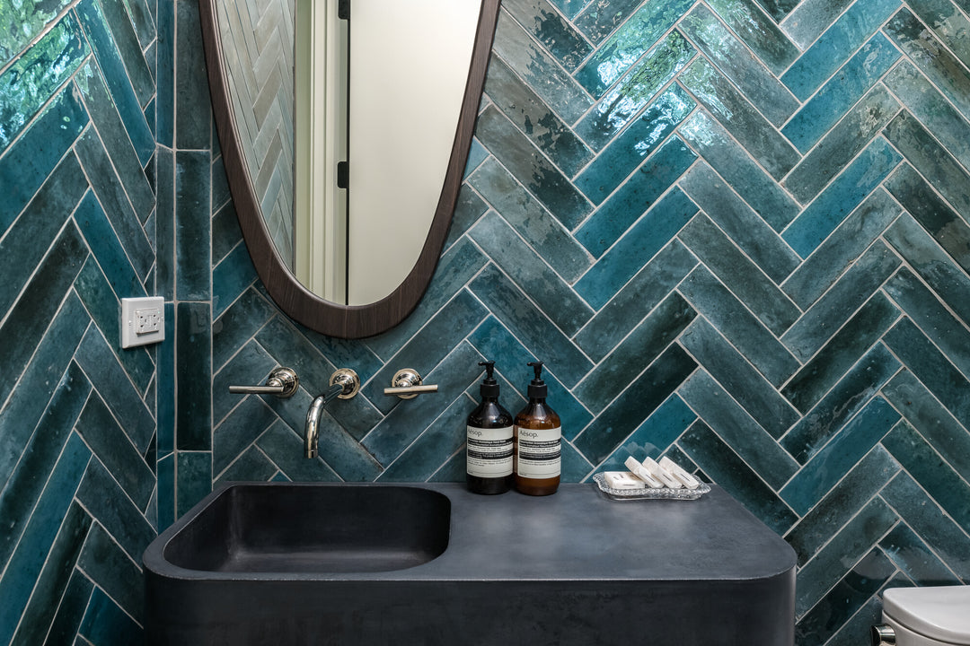 Remedy Hydro 2x10 glossy glazed porcelain tile featured in a contemporary arrangement, offering a fresh color with high-shine appeal.