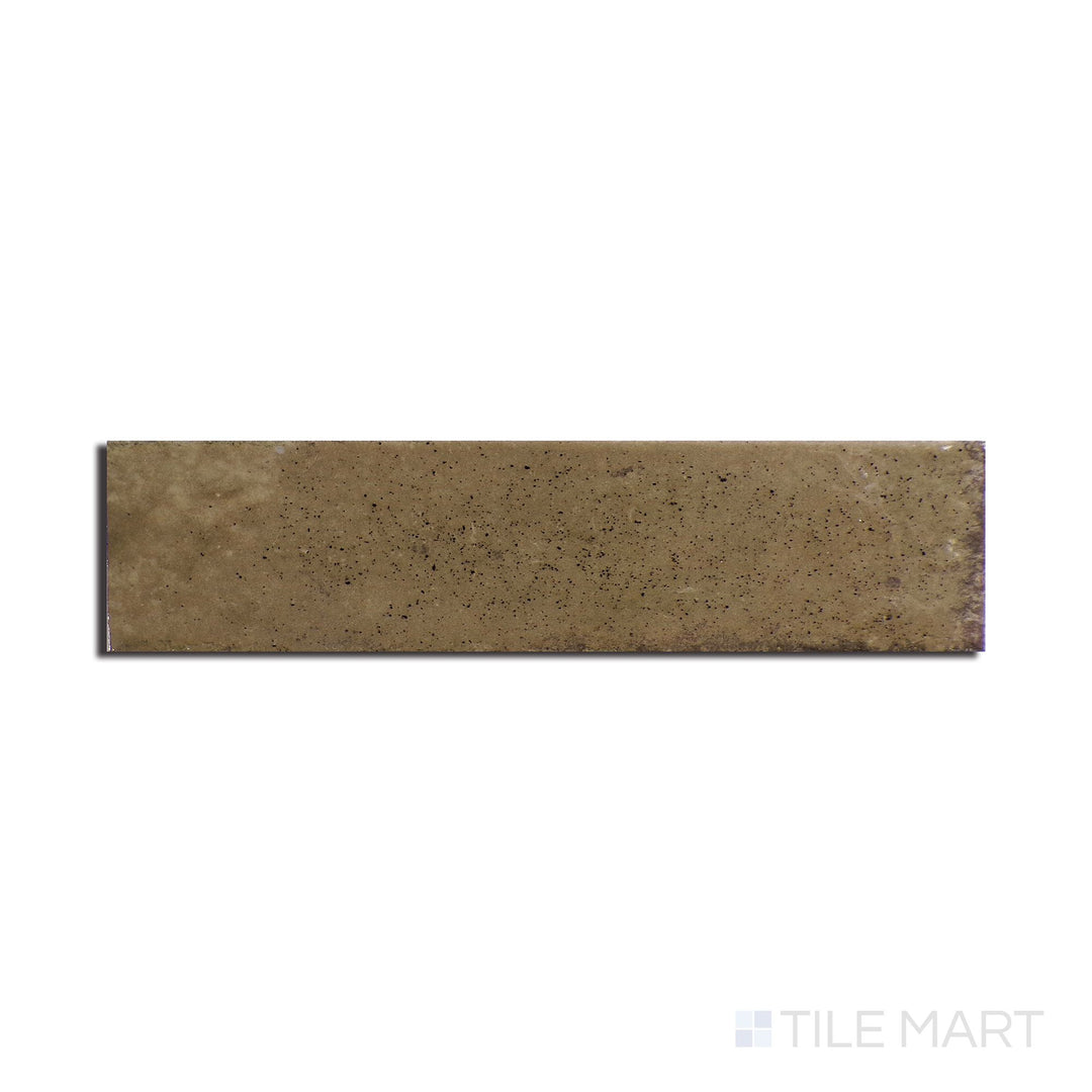 Angled shot of Remedy Antidote 2x10 glossy glazed porcelain tile, featuring a bold, sophisticated shade, a smooth reflective surface, and a contemporary elongated look.  