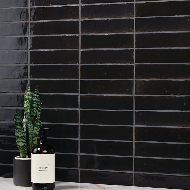 A sophisticated, alchemic hue with a glossy glaze brings a contemporary and artistic touch in this Remedy Alchemy 2x10 glazed porcelain tile.