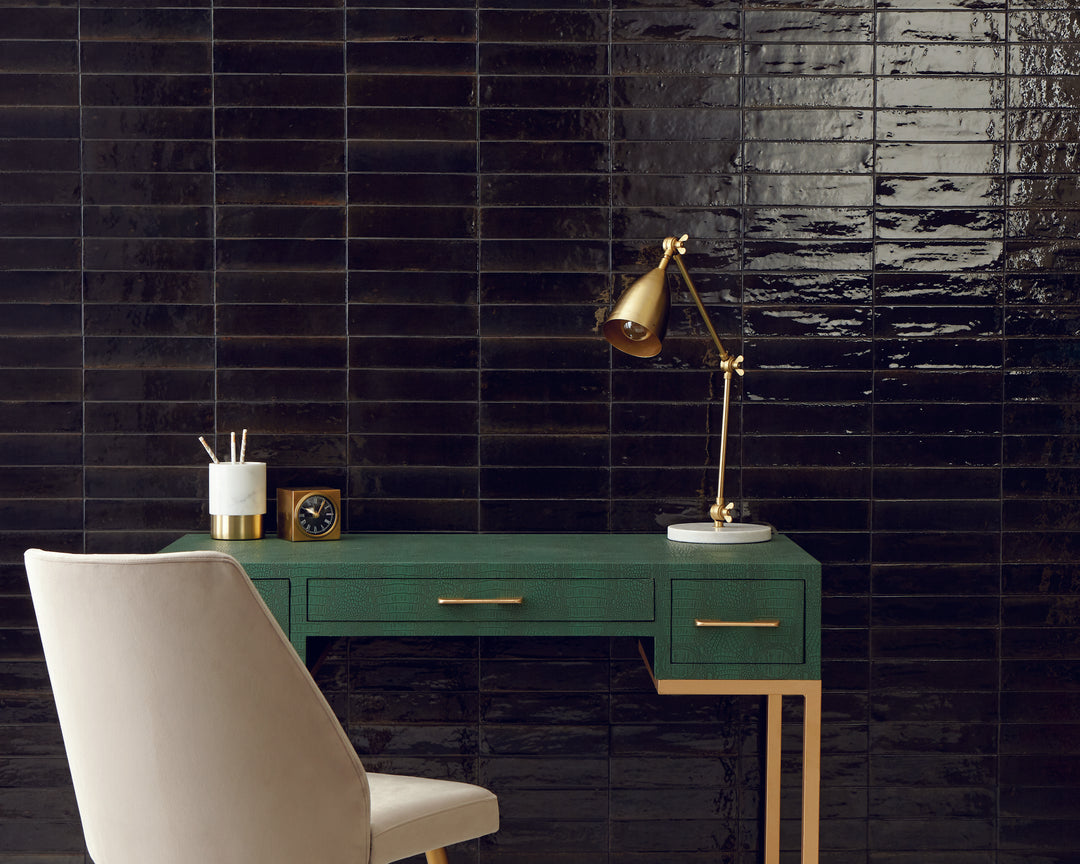 Seen in a completed space, the Remedy Alchemy 2x10 glossy glazed porcelain tile delivers a modern, polished look with a luminous finish