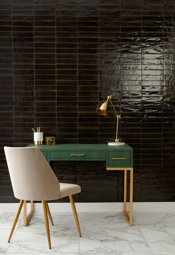 Remedy Alchemy 2x10 glossy glazed porcelain tile displayed in a sleek layout, reflecting its rich color and smooth glazed surface.