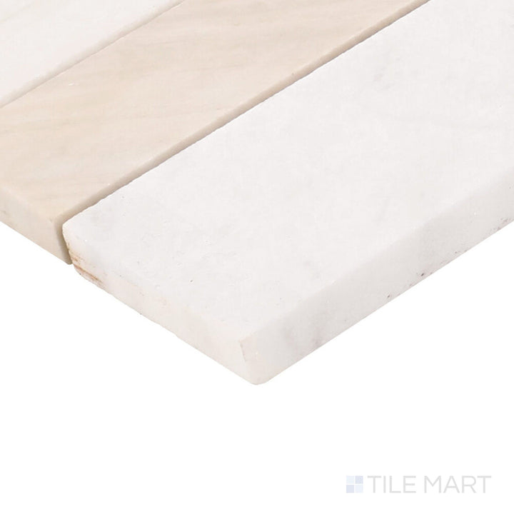 Close-up corner shot of Perfit Mosaix Namaste & Thassos Random Honed Mosaic, featuring its organic random arrangement with a honed white marble surface.