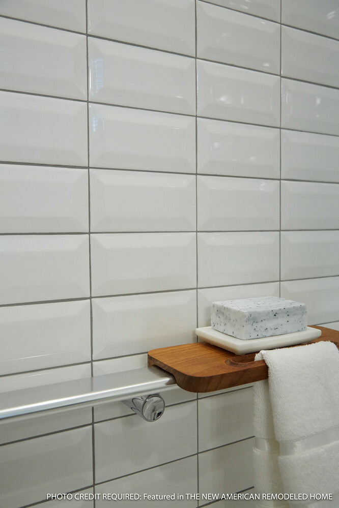 Used in an interior installation, the Color Wheel Classic Arctic White 3x6 beveled glossy glazed ceramic tile brightens the space with a crisp, reflective finish