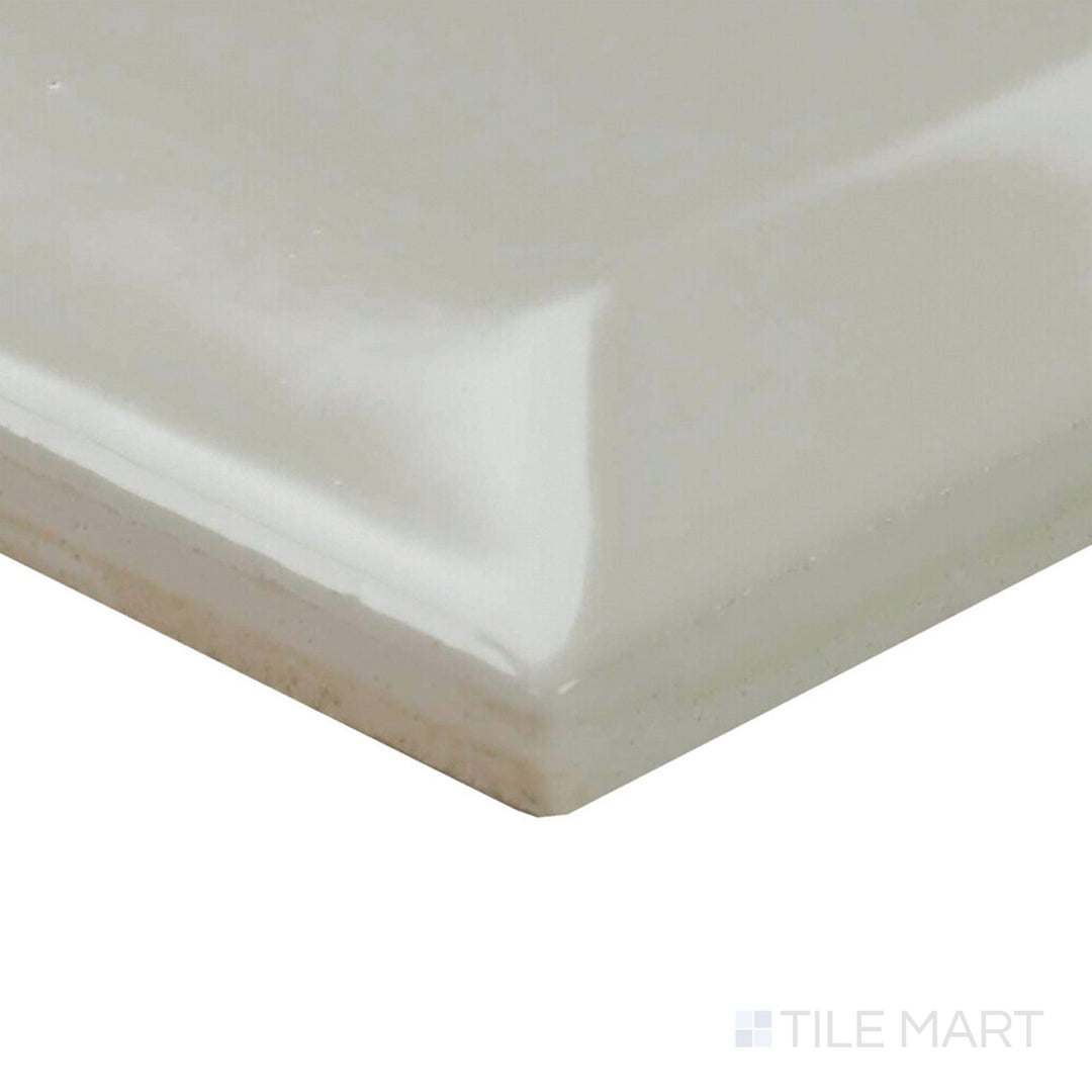 Corner perspective of Color Wheel Classic Desert Gray 3x6 beveled glossy ceramic tile highlights its cool gray tone and traditional form.