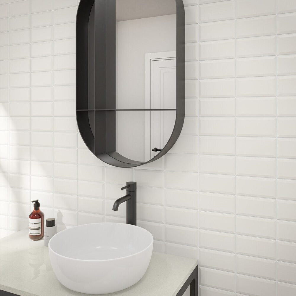 In a refined roomscape, Color Wheel Classic Arctic White 3x6 beveled matte glazed ceramic tile stands out with its soft finish and clean, structured look.