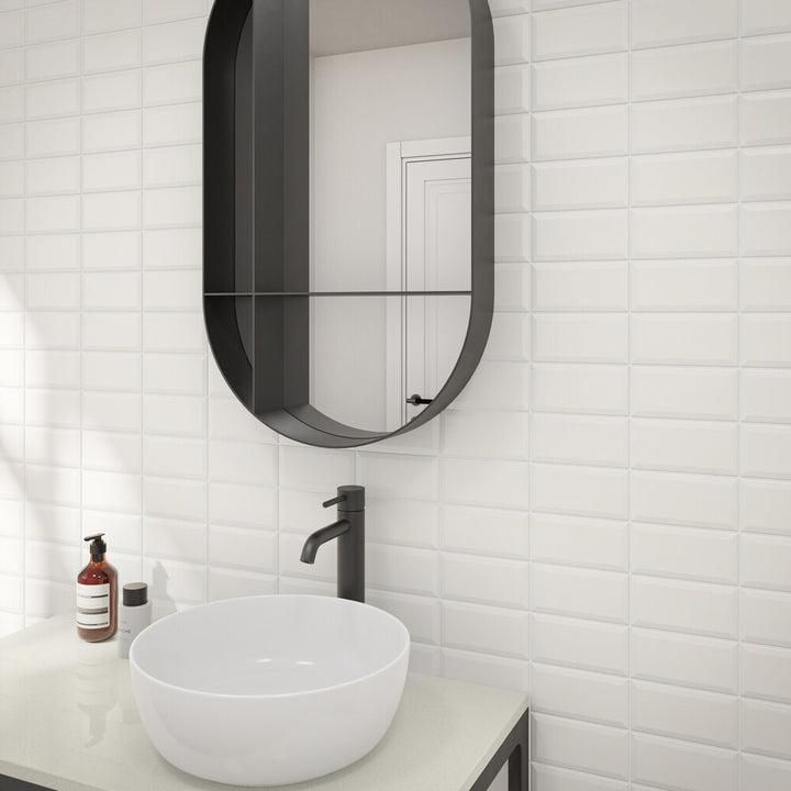 In a refined roomscape, Color Wheel Classic Arctic White 3x6 beveled matte glazed ceramic tile stands out with its soft finish and clean, structured look.