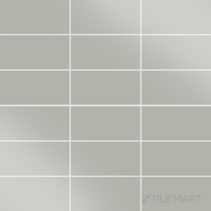 Displayed in full, the Color Wheel Classic Desert Gray 3x6 glossy glazed ceramic tile features a smooth glossy surface and classic rectangular shape