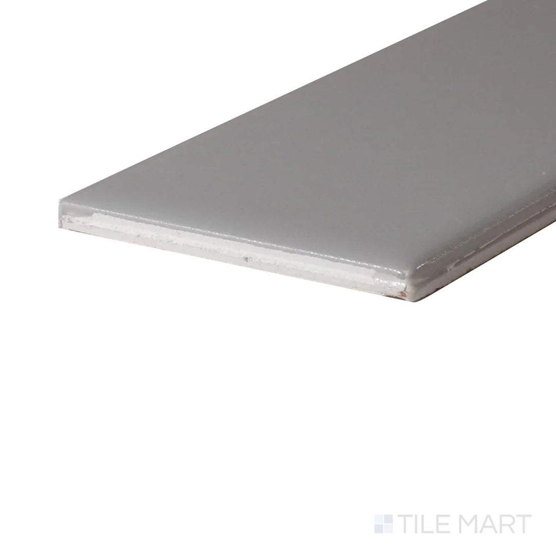 Corner shot of Color Wheel Classic Desert Gray 3X6 Glossy Glazed Ceramic, showcasing its sleek finish and neutral gray tone for versatile design applications.