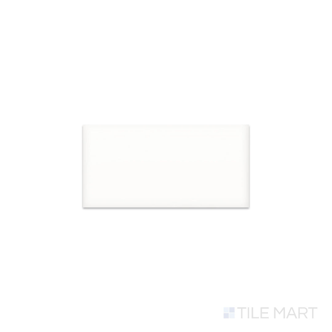 Slanted perspective of Color Wheel Classic Arctic White 3x6 glossy glazed ceramic tile, emphasizing a crisp arctic white tone, a smooth high-gloss finish, and an elongated rectangular design.  