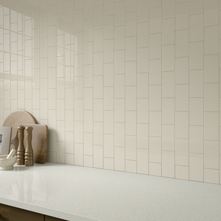 Showcased in a neutral-toned space, Color Wheel Classic Almond 3x6 glossy glazed ceramic tile delivers a soft, creamy color with a smooth, glossy surface.