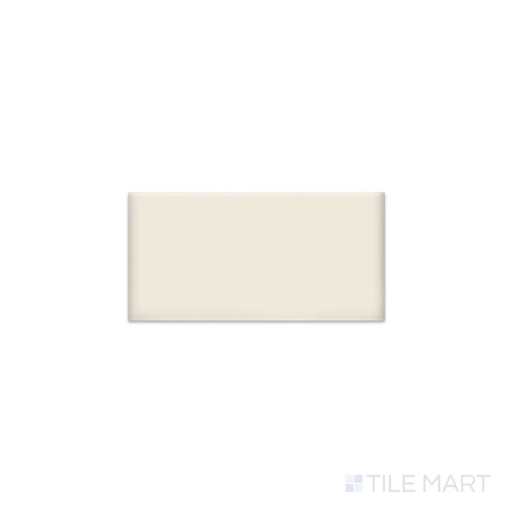 Diagonal view of Color Wheel Classic Biscuit 3x6 glossy glazed ceramic tile, showcasing a soft beige biscuit hue, a luminous glossy finish, and a classic subway tile layout.  