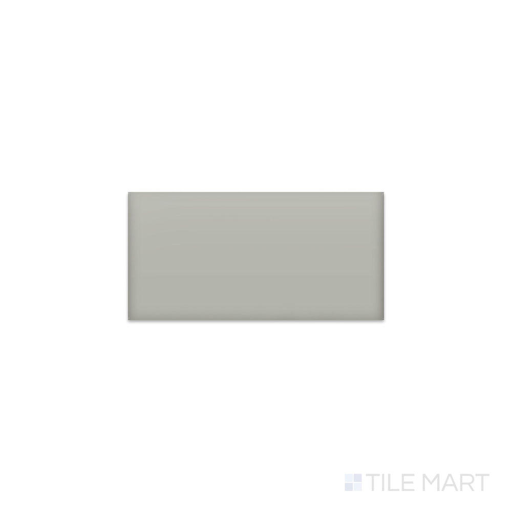 Angled shot of Color Wheel Classic Desert Gray 3x6 matte glazed ceramic tile, featuring a smooth, non-reflective surface with a cool-toned gray hue and a classic rectangular layout.  