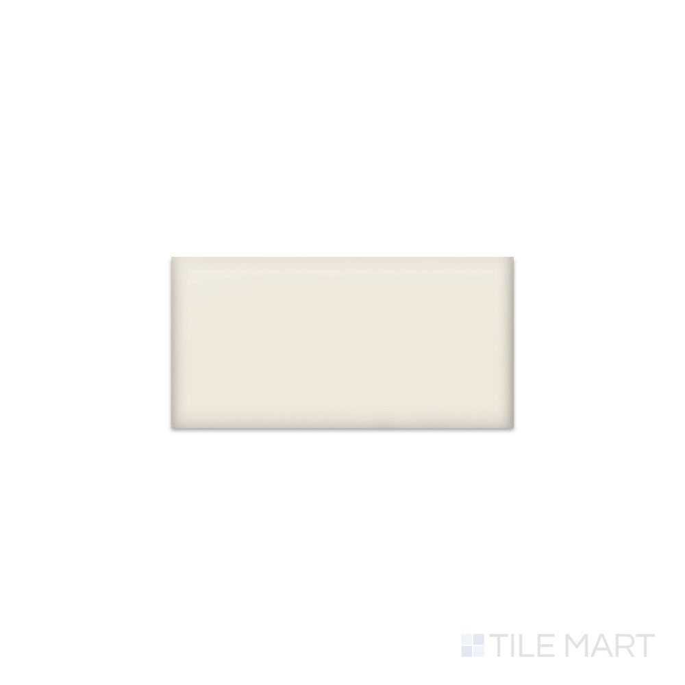 Slanted perspective of Color Wheel Classic Biscuit 3x6 matte glazed ceramic tile, emphasizing a subtle beige biscuit color, a smooth matte surface, and a rectangular subway tile format.  