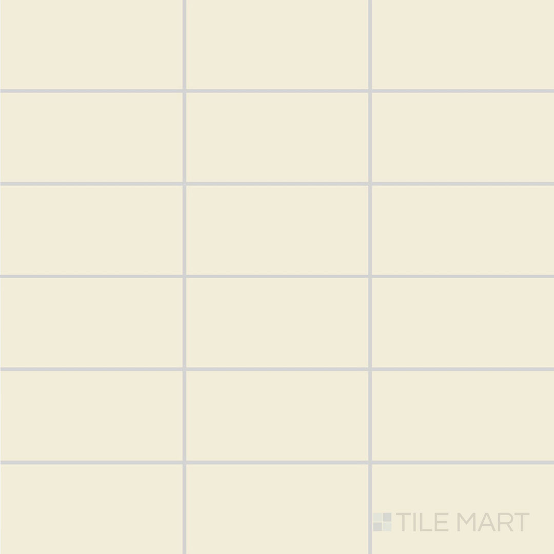 A top-down view of the Color Wheel Classic Almond 3x6 matte glazed ceramic tile reveals a soft, warm almond hue with a velvety smooth surface, perfect for timeless interior designs.