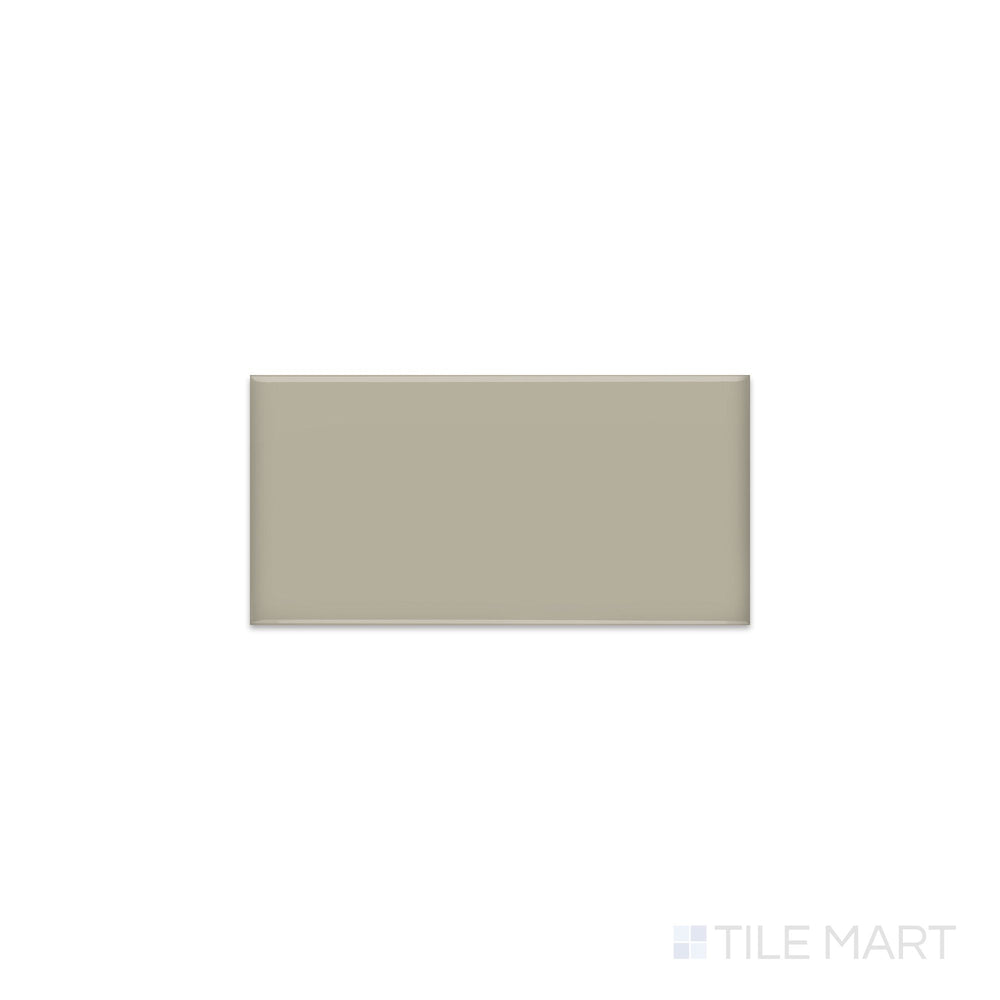 Slanted perspective of Color Wheel Classic Architectural Gray 3x6 glossy glazed ceramic tile, emphasizing a refined gray shade, a smooth polished surface, and a contemporary linear design.  