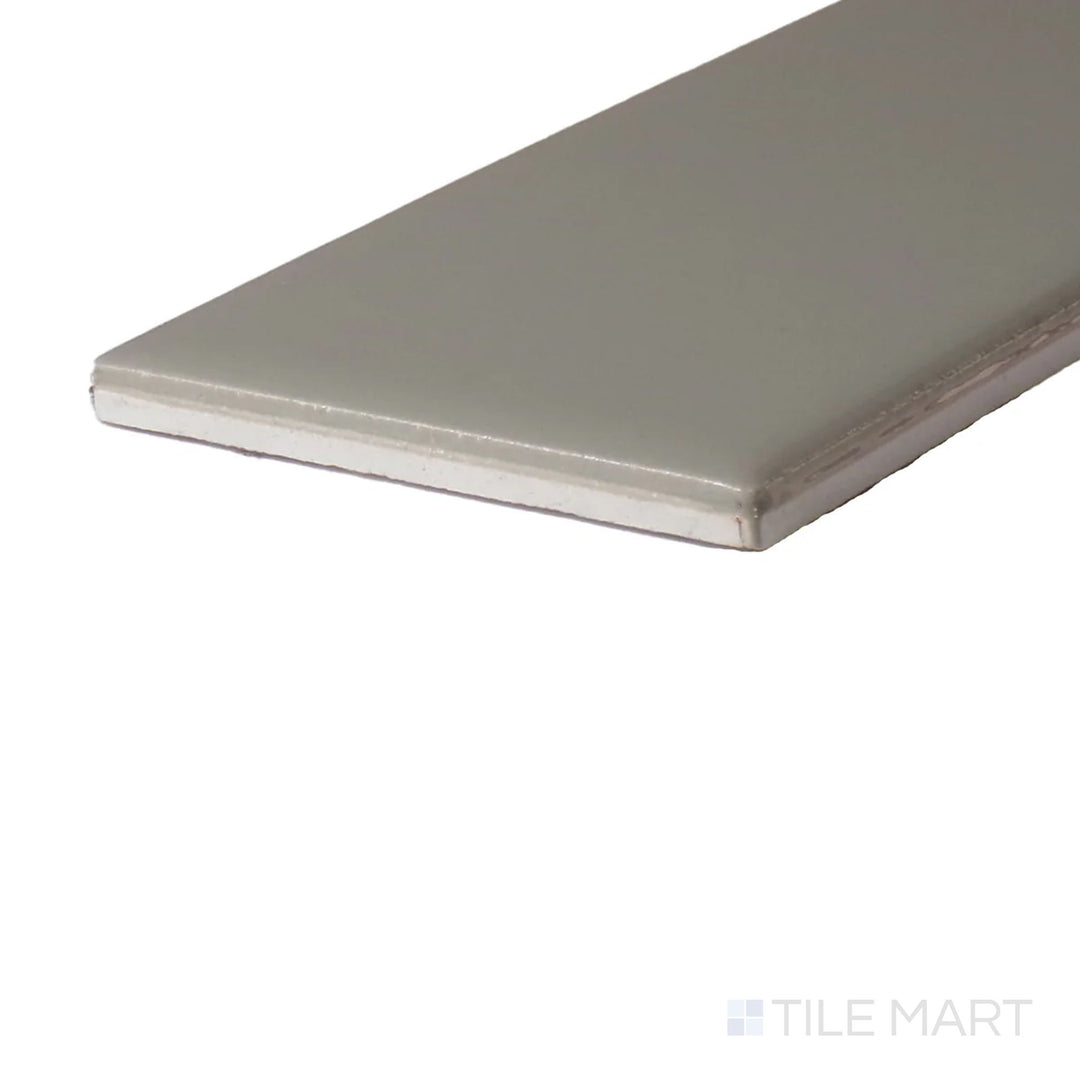 Side perspective of Color Wheel Classic Architectural Gray 3X6 Glossy Glazed Ceramic, capturing its modern gray hue with a polished, high-shine finish.