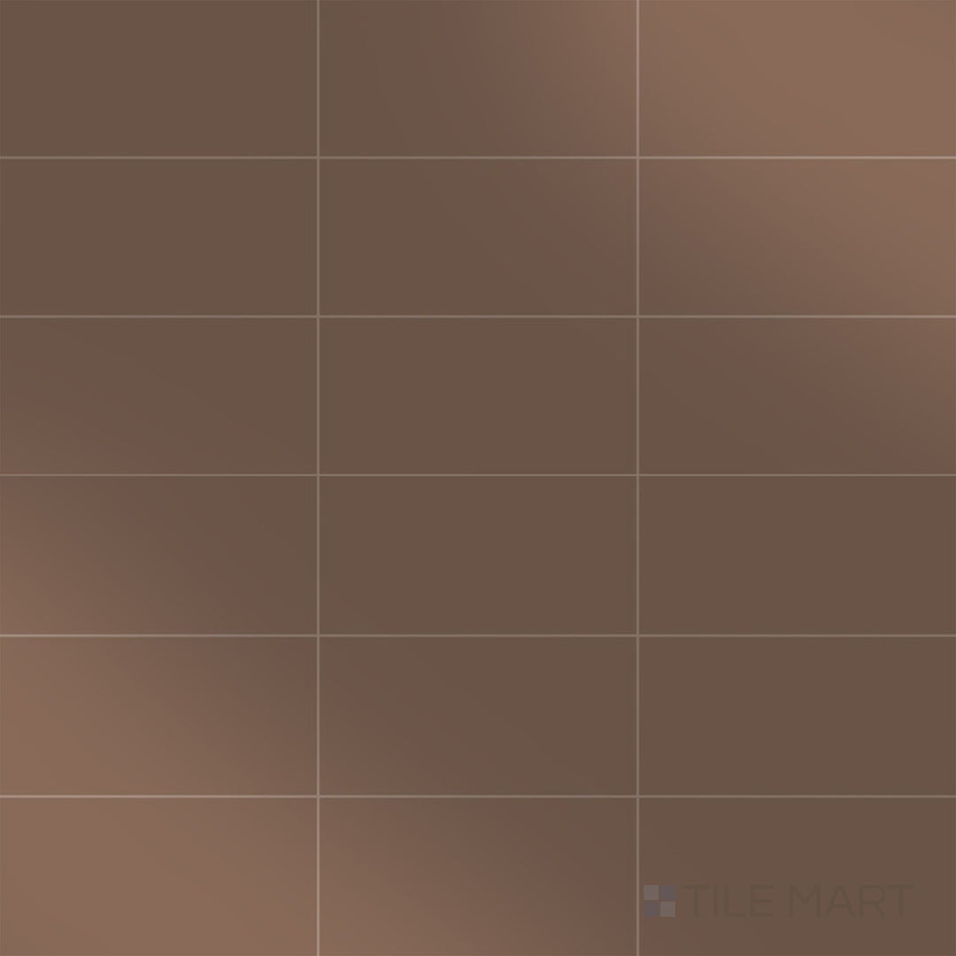 The overhead perspective highlights the rich, earthy tones of the Color Wheel Classic Artisan Brown 3x6 glossy glazed ceramic tile, with its polished glaze adding a refined touch.