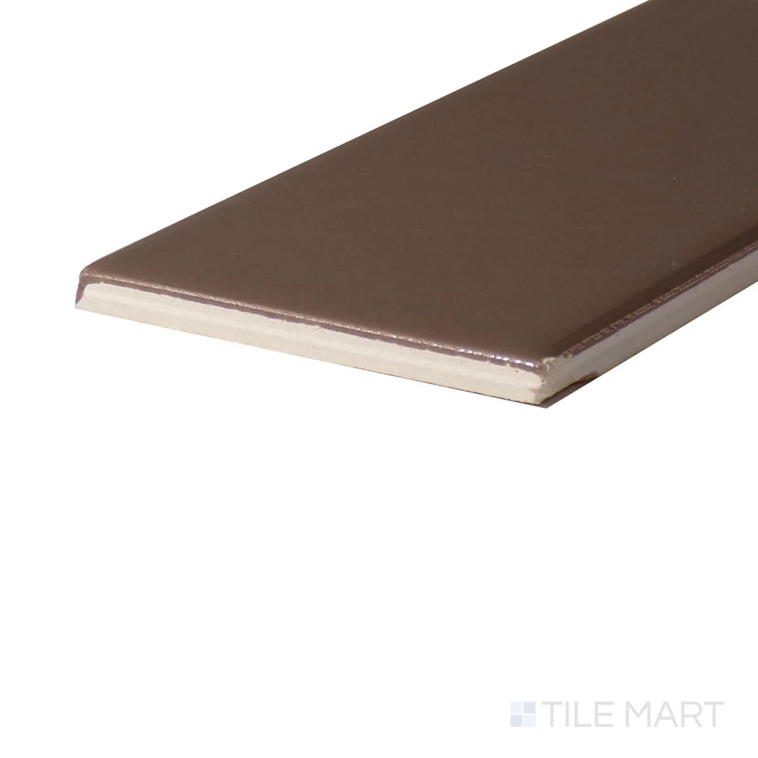 Angled close-up of Color Wheel Classic Artisan Brown 3X6 Glossy Glazed Ceramic, showcasing its rich brown tone with a smooth, reflective surface.