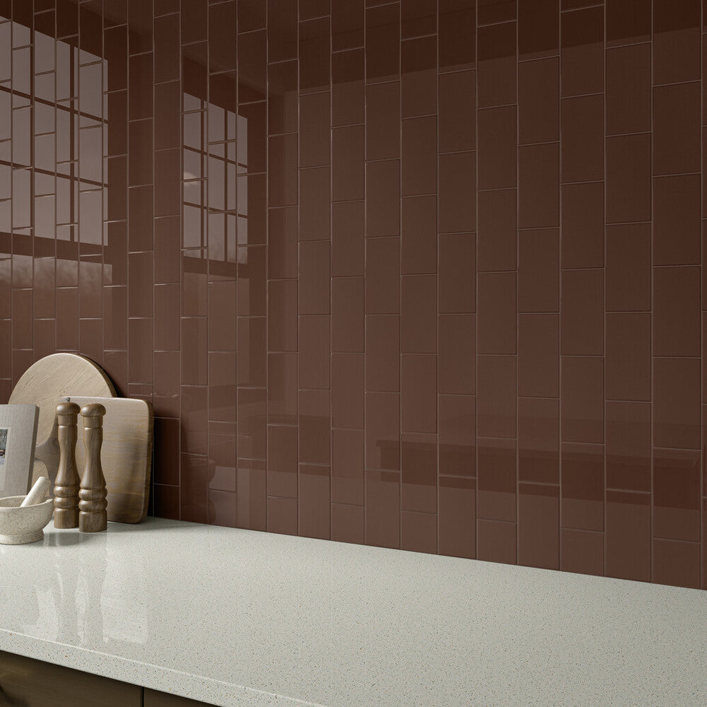 With rich, earthy appeal, the Color Wheel Classic Artisan Brown 3x6 glossy glazed ceramic tile brings warmth and character to the space in this roomscene.