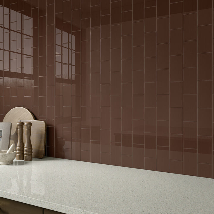 With rich, earthy appeal, the Color Wheel Classic Artisan Brown 3x6 glossy glazed ceramic tile brings warmth and character to the space in this roomscene.