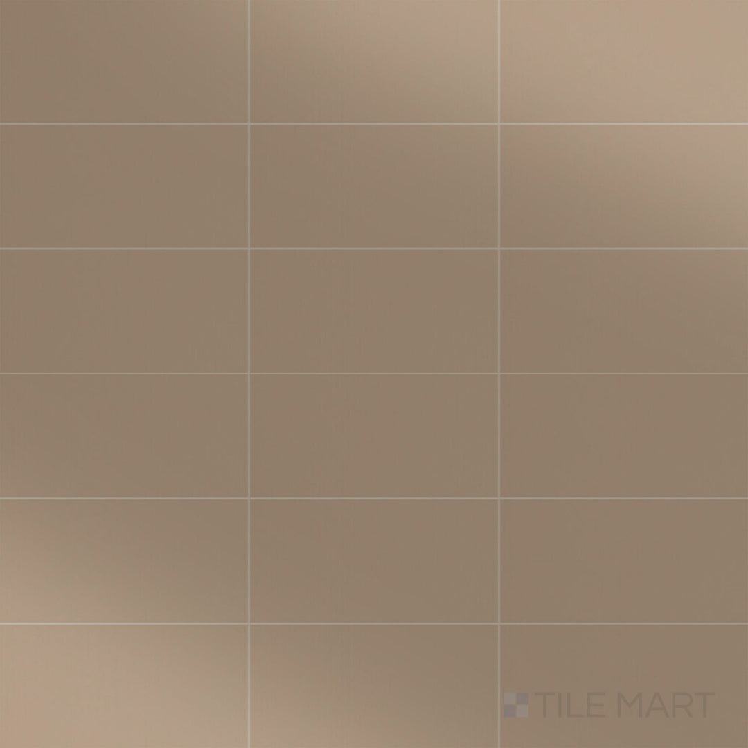 A top-down view of the Color Wheel Classic Elemental Tan 3x6 glossy glazed ceramic tile showcases a warm, earthy tan hue with a reflective finish, adding natural elegance to any space.