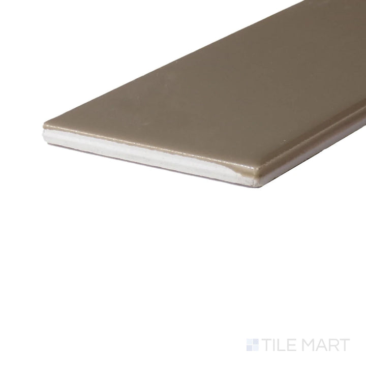 Close-up corner shot of Color Wheel Classic Elemental Tan 3X6 Glossy Glazed Ceramic, featuring its soft tan color with a high-shine glaze for a refined finish.